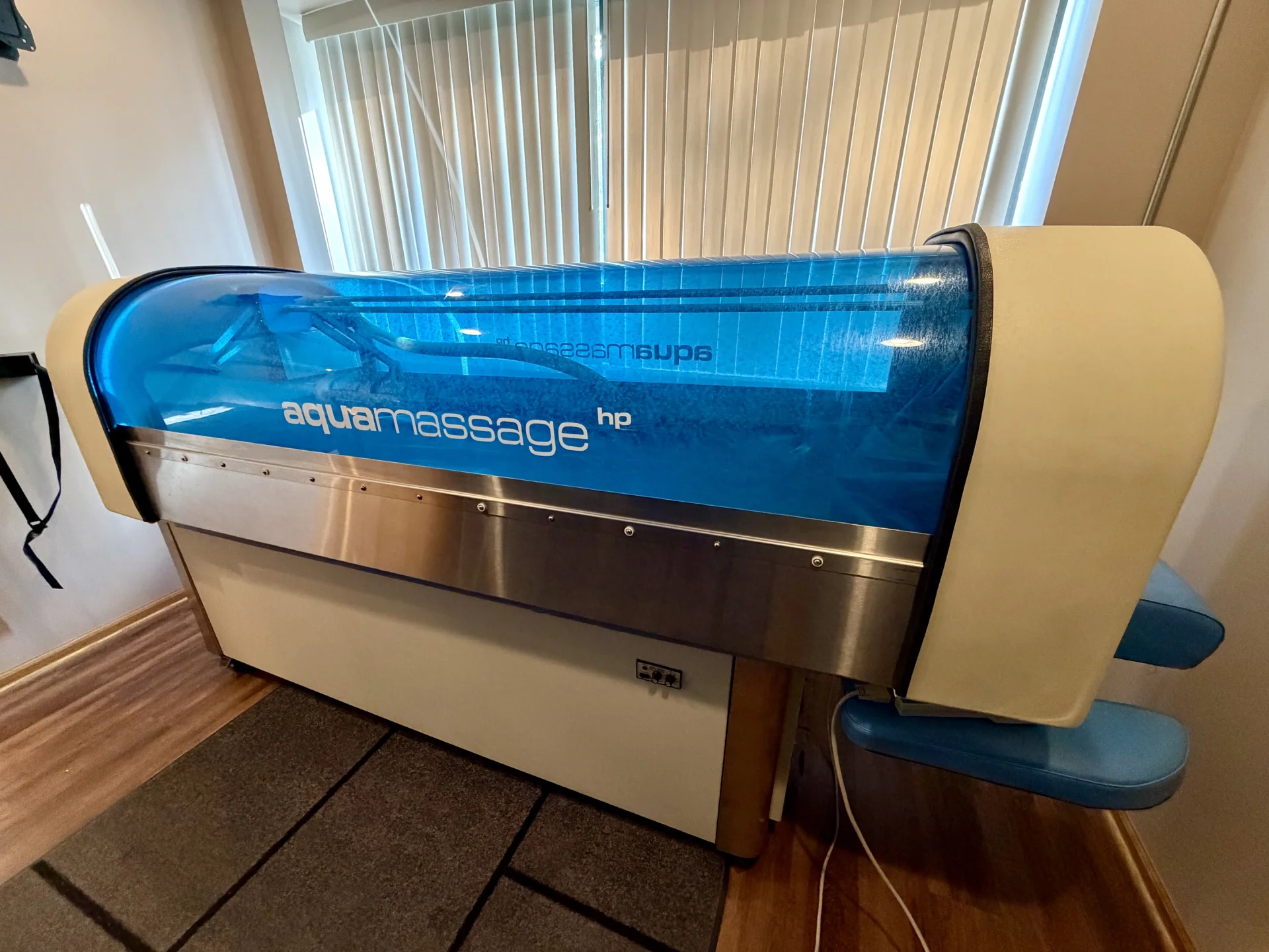 Aquamassage HP hydrotherapy massage table in a chiropractic treatment room