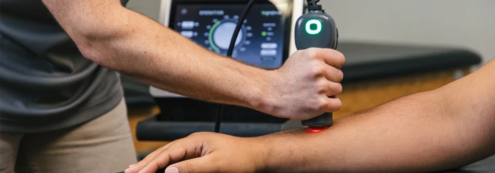 Lightforce Deep Tissue Laser Therapy Machine in Use on Patient Arm
